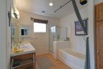 The master bath has a dual vanity, step in shower and soaking tub